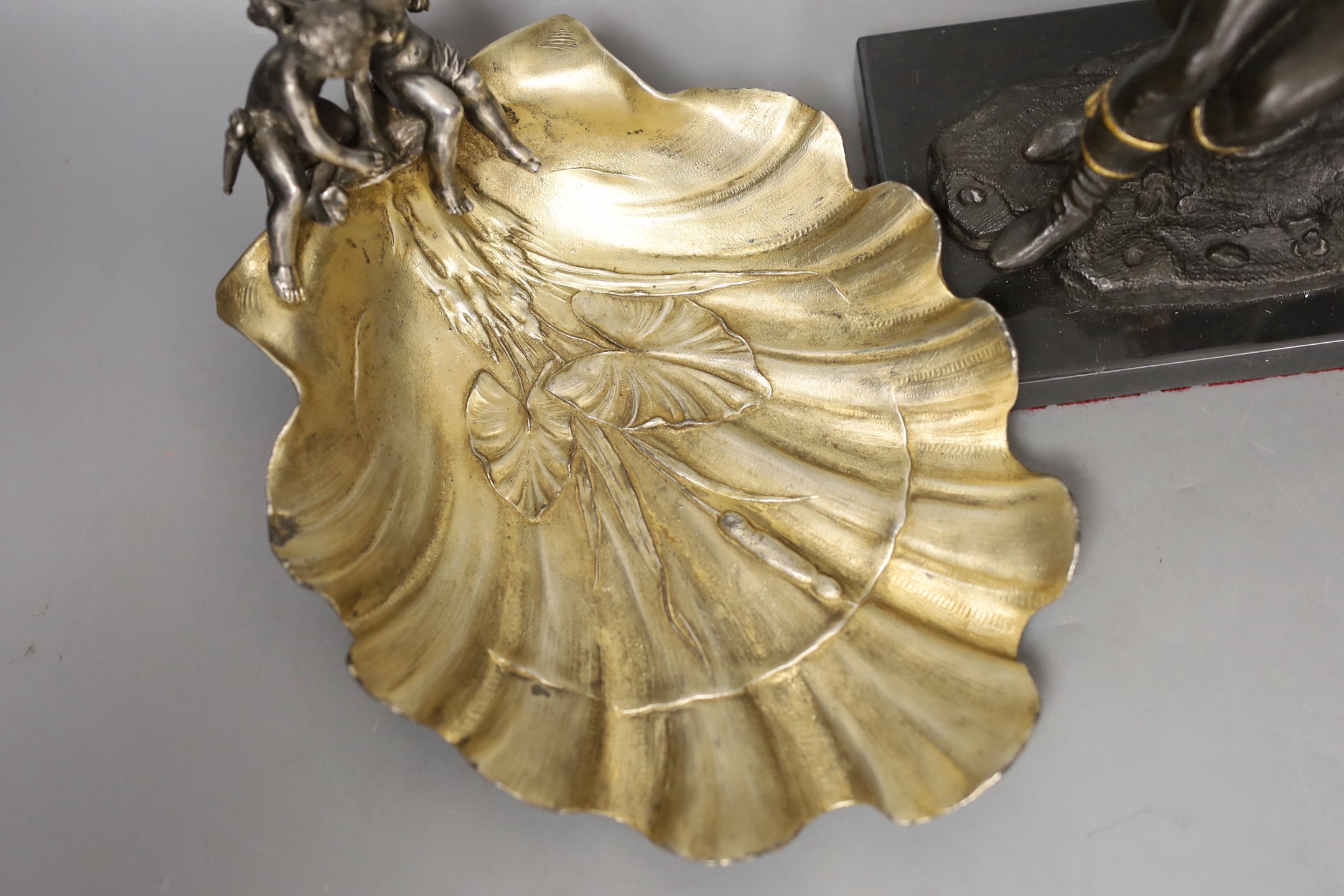 A WMF style plated ‘cherub’ shell dish, and a spelter figure of a seated male reading